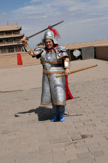 23 6l8. eclipse - China - Gordon - Wendy as warrior at Great Wall fort