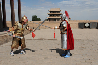 24 6l8. eclipse - China - Gordon - Adam and Wendy as warriors at Great Wall fort