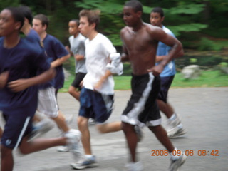 Merrell refrigerator photo of him running an indoor-track race