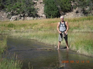 Dustin crossing river - hiking at Pine Valley, Utah