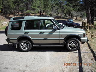 Dustin carrying Adam across river - hiking at Pine Valley, Utah
