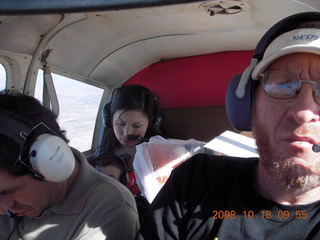 Richard, Jane, Abigail all all asleep and Adam flying N4372J