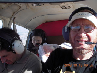 Richard, Jane, Abigail all all asleep and Adam flying N4372J