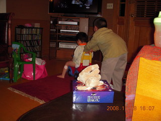 Cecelia and Gaby riding the toy truck