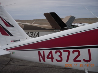 600 6ps. N4372J on the ground at Canyonlands Airport (CNY) next to a Beech Bonanza