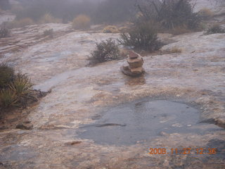 Canyonlands National Park - Lathrop trail hike - raindrops on pothole puddle