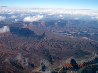 129 6pu. aerial - Canyonlands area with puffy clouds