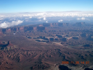 131 6pu. aerial - Canyonlands area with puffy clouds