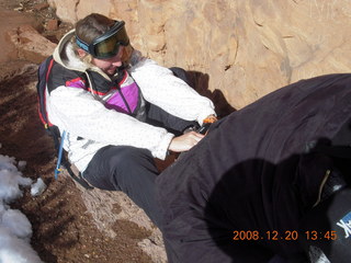 38 6ql. Zion National Park - Angels Landing hike - Debbie putting on crampon