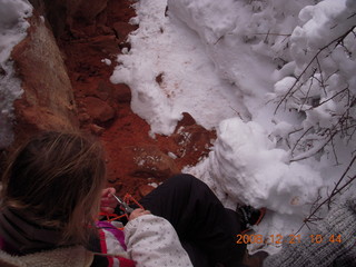 126 6qm. Zion National Park - Emerald Pools hike - Debbie fixing a crampon - Leatherman Supertool 2000 to the rescue