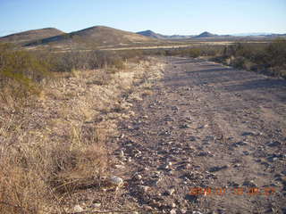 19 6ra. Tombstone run - side road with distant hills