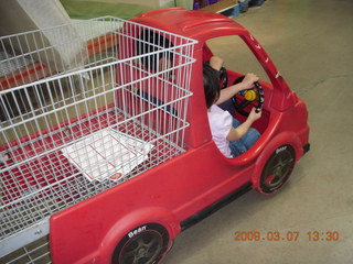 Gaby and Cecelia in shopping-cart car