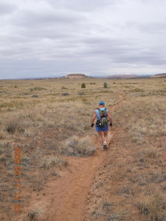 247 6uh. Canyonlands - Lathrop trail hike - Adam running - grassy run at end - back