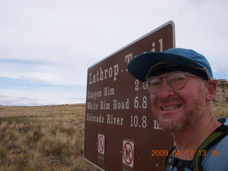 249 6uh. Canyonlands - Lathrop trail hike - Adam at trailhead sign