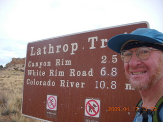 Canyonlands - Lathrop trail hike - Adam at trailhead sign