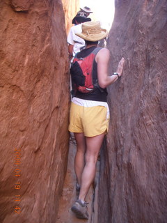 Arches National Park - Fiery Furnace hike - hikers squeezing