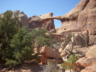 71 6ul. Arches National Park - Devil's Garden hike - two fellows atop Double-O Arch