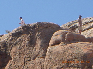 73 6ul. Arches National Park - Devil's Garden hike - two fellows atop Double-O Arch