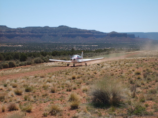 18 6un. Charles Lawrence photo - Charles and Adam landing N4372J at Fry Canyon - in-flight photo