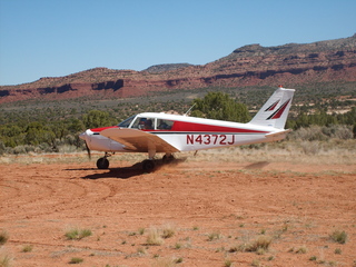 19 6un. Charles Lawrence photo - Charles and Adam landing N4372J at Fry Canyon