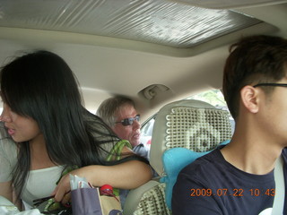 105 6xn. China eclipse - driving down from Anji - people in car
