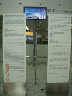 64 6xp. China eclipse - Shanghai airport sign with carry-on rules