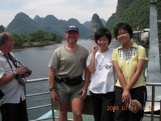 237 6xq. China eclipse - Li River  boat tour - Adam and other tourists