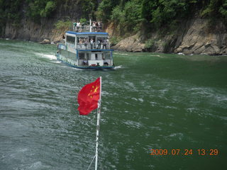 440 6xq. China eclipse - Li River  boat tour - China flag
