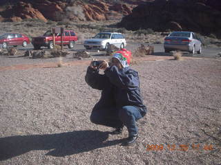 128 72r. Snow Canyon State Park - Christmas tourist taking a picture