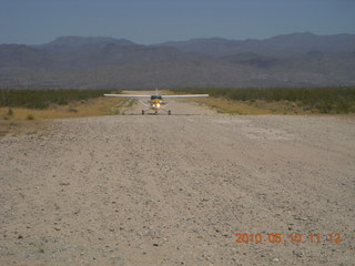 128 77a. Alamo Lake airstrip - landing airplane