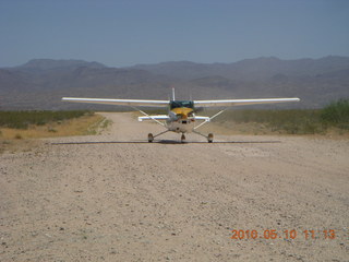 129 77a. Alamo Lake airstrip - landing airplane