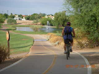 Adam riding bicycle on Green Belt in Scottsdale