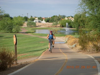 Adam riding bicycle on Green Belt in Scottsdale