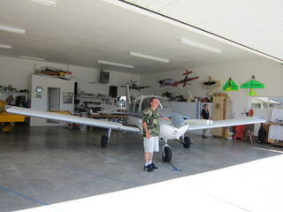 Bob and N8377W in Watkins hangar