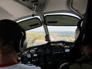 Adam's hands on N8377W controls, plus instruments