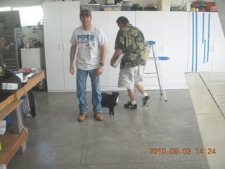 Sean, cat, and Bob in Watkins hangar