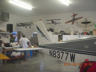 69 7b3. Bob, Sean, model planes, and N8377W in Watkins hangar