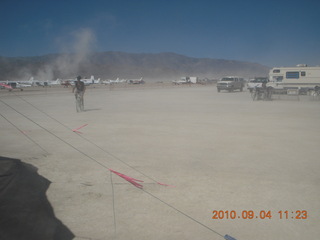 7S5 to DVT trip - Nevada - Black Rock City - Burning Man entrance - woman with face protected