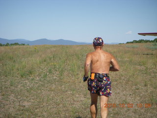 28 7c2. Adam running at Me-Own airstrip (with SPOT on the belt strap) - back