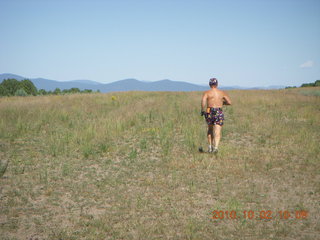 29 7c2. Adam running at Me-Own airstrip (with SPOT on the belt strap) - back