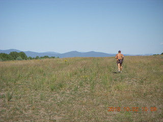 30 7c2. Adam running at Me-Own airstrip (with SPOT on the belt strap) - back