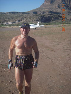 Adam running at Me-Own airstrip (with SPOT on the belt strap) - back