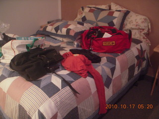 2 7ch. hotel bedspread with clothes and stuff