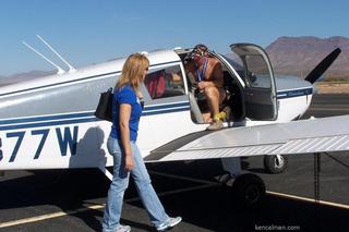 82 7cw. Safford fly-in and half marathon - Ken's photo - Bonnie abnd Adam getting into N8377W