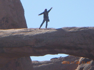 17 7dr. Moab trip - Arches Devil's Garden hike - waving person on top of Double-O Arch