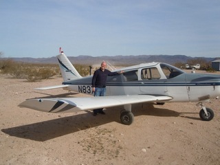 219 7g6. Antoine's pictures - Antoine and N8377W at Alamo Lake airstrip