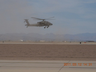 Apache helicopter flying at Gateway Airport (IWA)