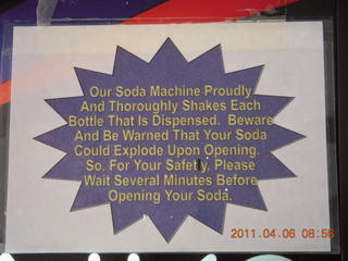 'Our Soda Machine Proudly...Shakes Each Bottle...' sign at Page Classic Aviation FBO