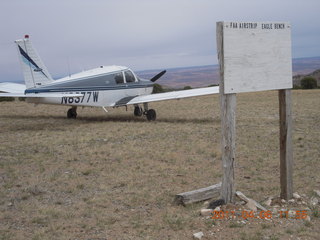 100 7j6. Eagle City airstrip and N8377W and sign