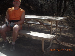 131 7j7. Canyonlands Lathrop hike/run - Adam at riverside picnic table at (tripod)